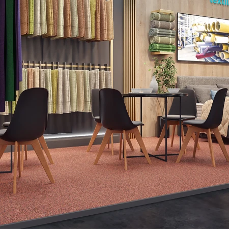 Woningtextiel wordt gepresenteerd op een elegante beursstand. De in kleur afgestemde vloerbedekking bestaat uit voegvriendelijke kliktegels voor beursvloeren van gelijmd rubbergranulaat.