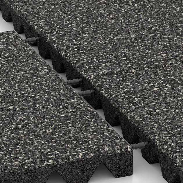 Großaufnahme vom Verbindungssystem von WARCO-Boden 5542 - Rubber speelplaatstegel 4,5 cm - EN 1177 ≤ 135 cm im Farbdesign Donkergrijs Graniet. Abmessungen 500 x 500 x 45 mm.
