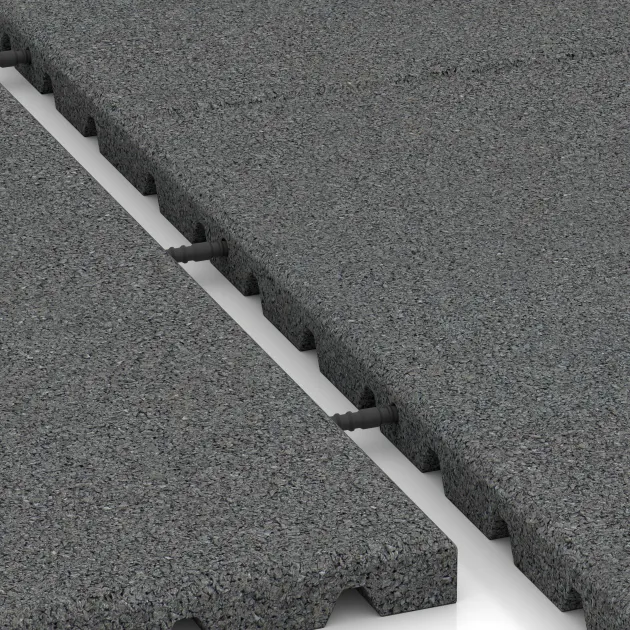 Großaufnahme vom Verbindungssystem von WARCO-Boden 0753 - Slagbeschermingsmat – schokabsorberende mat im Farbdesign Leigrijs. Abmessungen 1000 x 1000 x 30 mm.