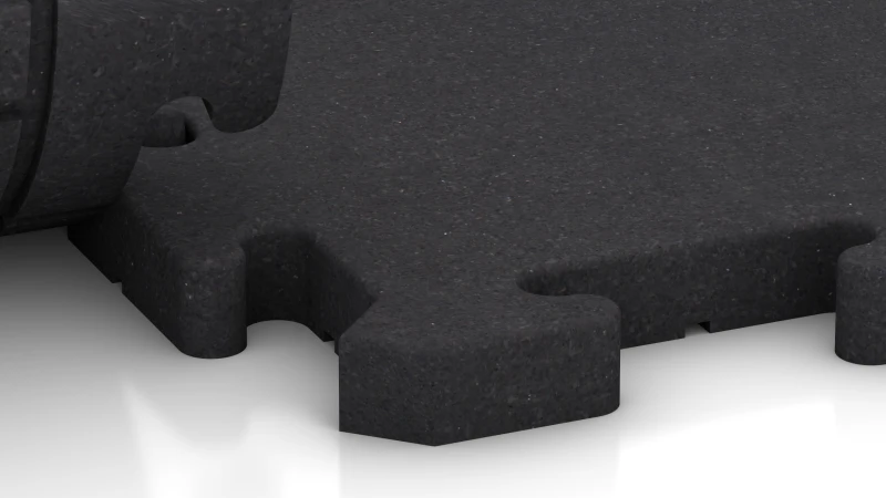 Detail van de 30 mm dikke fitnessvloer TZ met homogeen oppervlak. Geïnstalleerd in het oppervlak houden de tegels elkaar permanent vast dankzij het montagesysteem met ritssluiting (Puzzel).